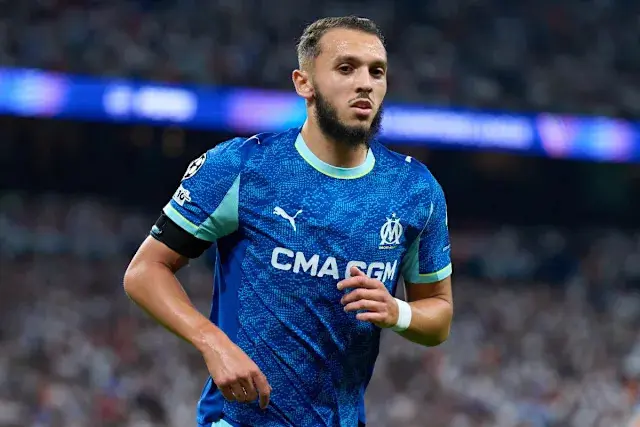 Amine Gouiri wearing Marseille's blue football kit during a match.