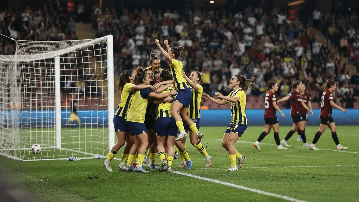 Women's football team celebrates a comeback victory in a European stadium